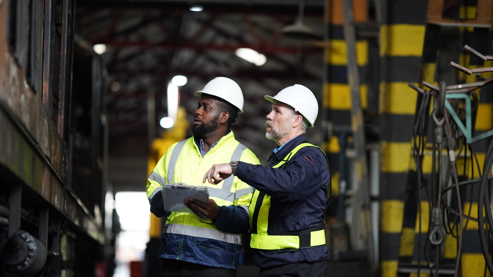 Portrait of maintenance engineer or apprentice in workshop of railway engineering facility